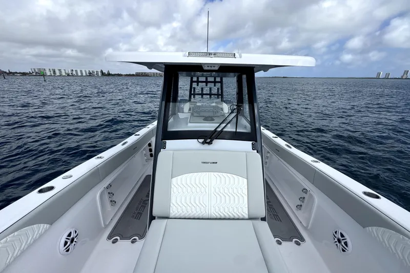 Slide: The Image of 2026 Twin Vee 280 GFX2 CC boat on open water, showcasing sleek design and spacious deck. - 15