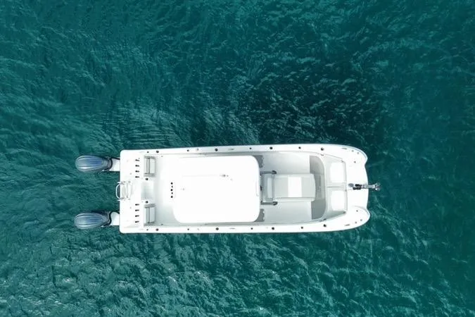 Slide: The Image of Aerial view of 2026 Twin Vee 280 GFX2 CC boat on clear blue water. - 6