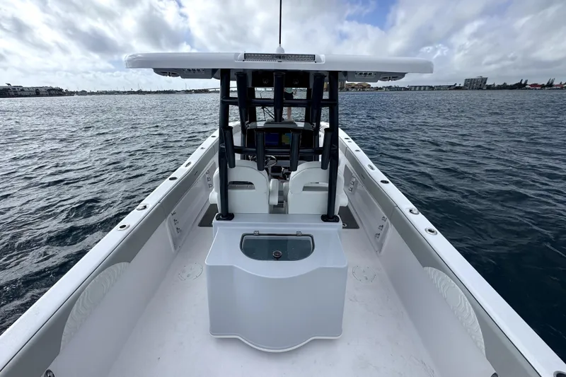 Slide: The Image of 2026 Twin Vee 280 GFX2 CC boat on open water, showcasing spacious deck and console. - 9