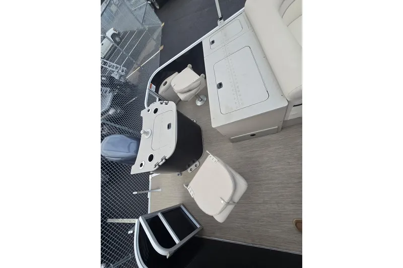 Slide: The Image of 2018 Bennington 22SSX boat interior with seating and storage compartments. - 6