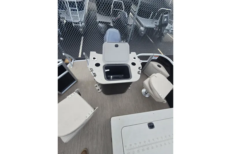 Slide: The Image of 2018 Bennington 22SSX boat interior with seating and storage compartments. - 7