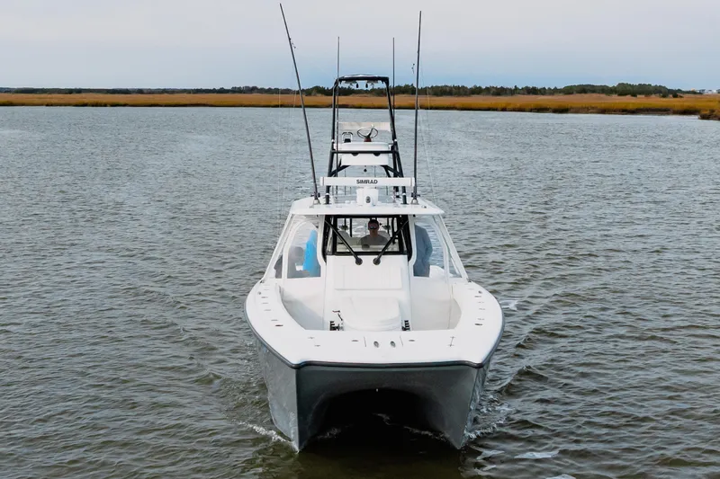 Slide: The Image of 2018 Freeman 37 VH boat cruising on calm water, front view. - 3