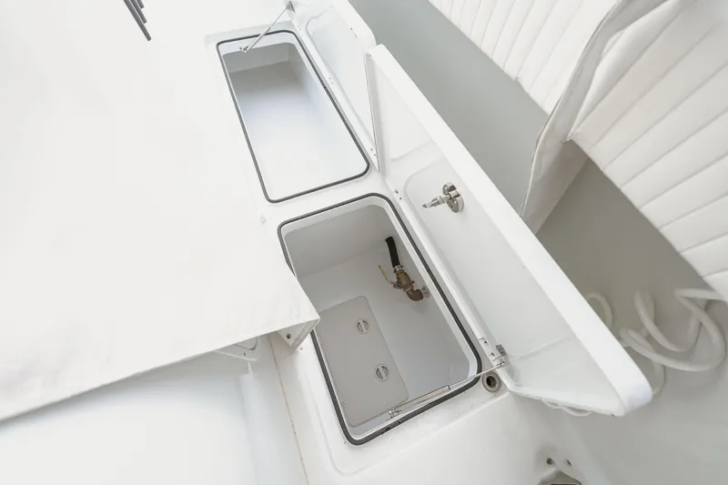 Slide: The Image of Open storage compartments on a 2018 Freeman 37 VH boat, showcasing interior details. - 34