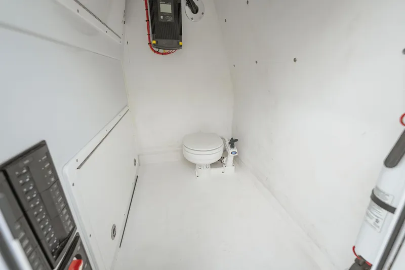 Slide: The Image of Interior of a 2018 Freeman 37 VH boat featuring a compact marine toilet. - 44