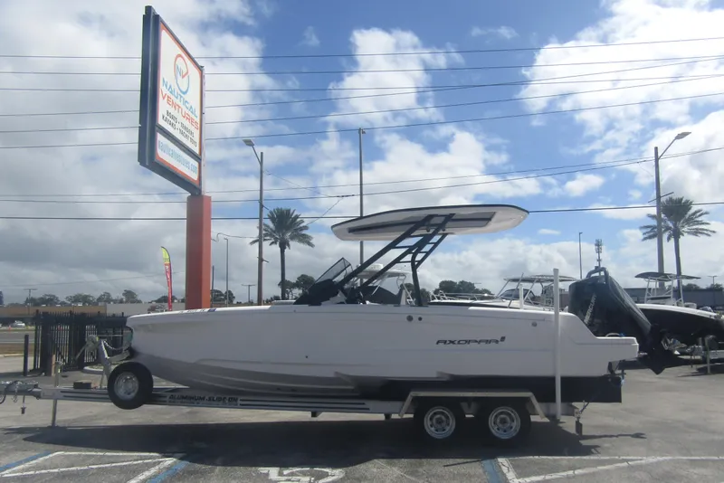 The Image of 2022 Axopar 22 T-Top boat on trailer at Nautical Ventures dealership. - 0
