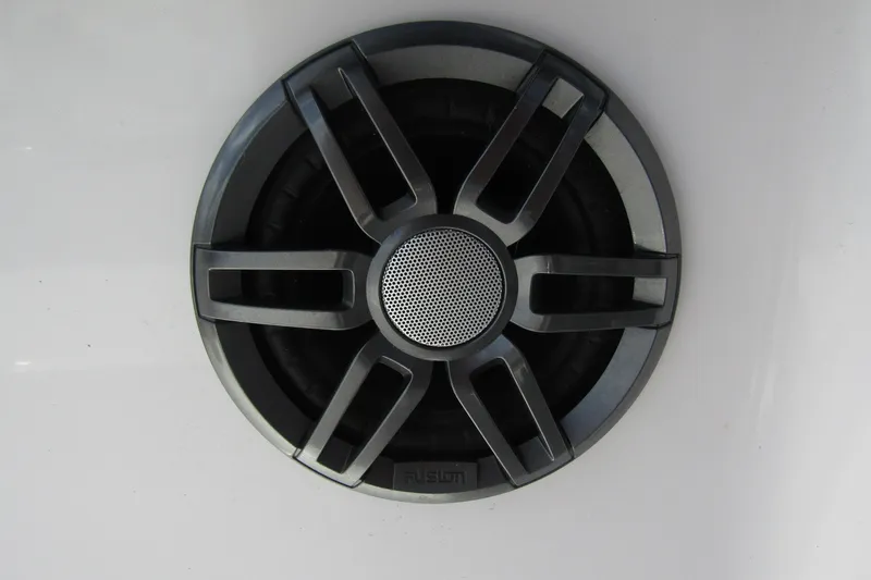 Slide: The Image of Speaker detail on 2022 Axopar 22 T-Top boat, featuring a sleek design. - 18