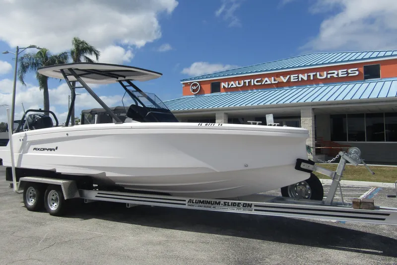 Slide: The Image of 2022 Axopar 22 T-Top boat on trailer at Nautical Ventures dealership. - 4