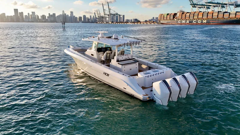 Slide: The Image of Luxury HCB Lujo 2021 yacht on water with city skyline. - 13