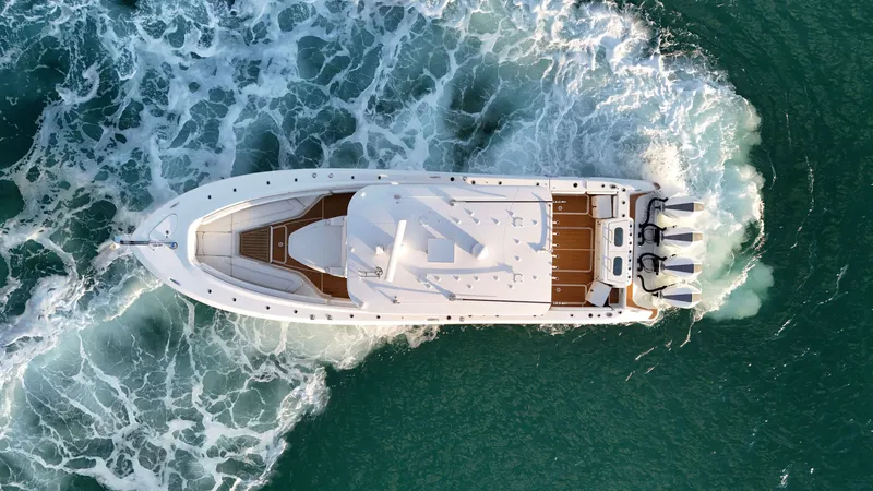 Slide: The Image of Aerial view of a 2021 HCB Lujo yacht cruising on the sea. - 20