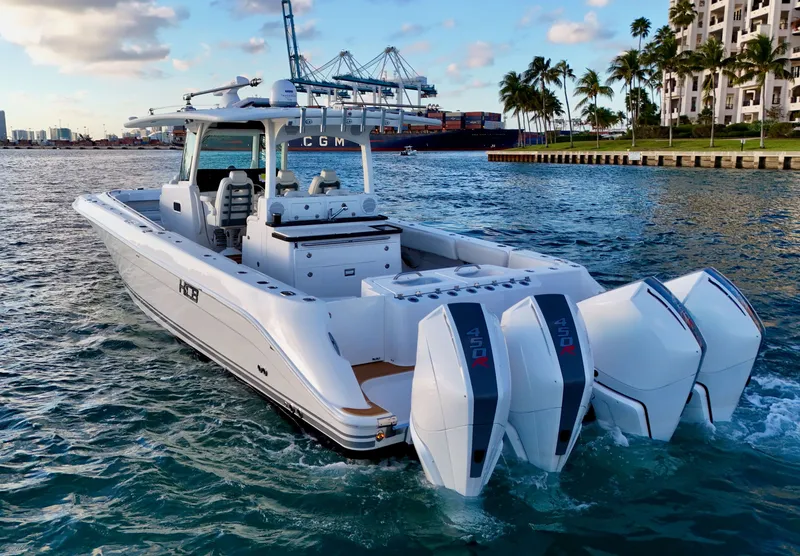 Slide: The Image of Luxurious 2021 HCB Lujo boat in harbor with palm trees in background. - 3