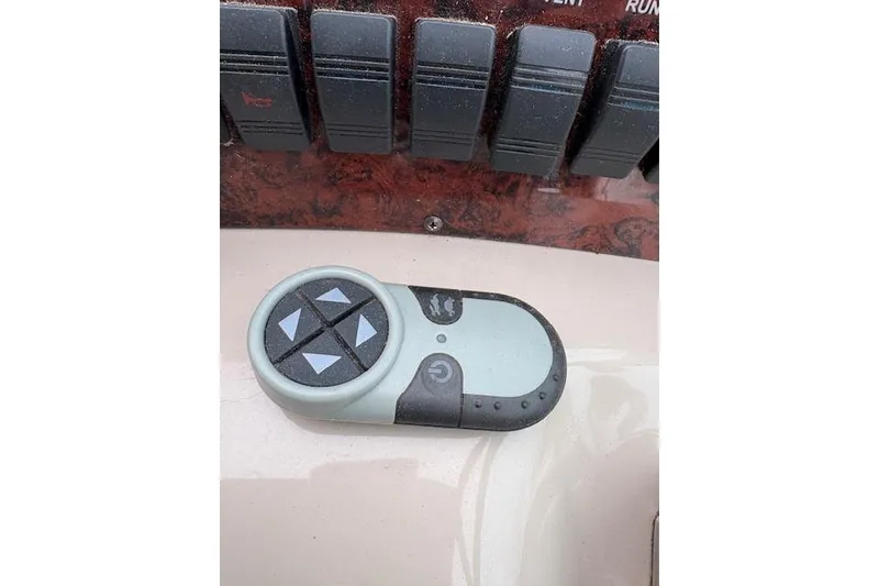Slide: The Image of Control panel of a 1998 Sea Ray Sundancer 330 boat with remote control. - 20