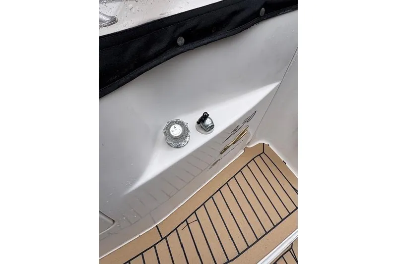 Slide: The Image of 1998 Sea Ray Sundancer 330 boat deck with fittings and non-slip flooring. - 27