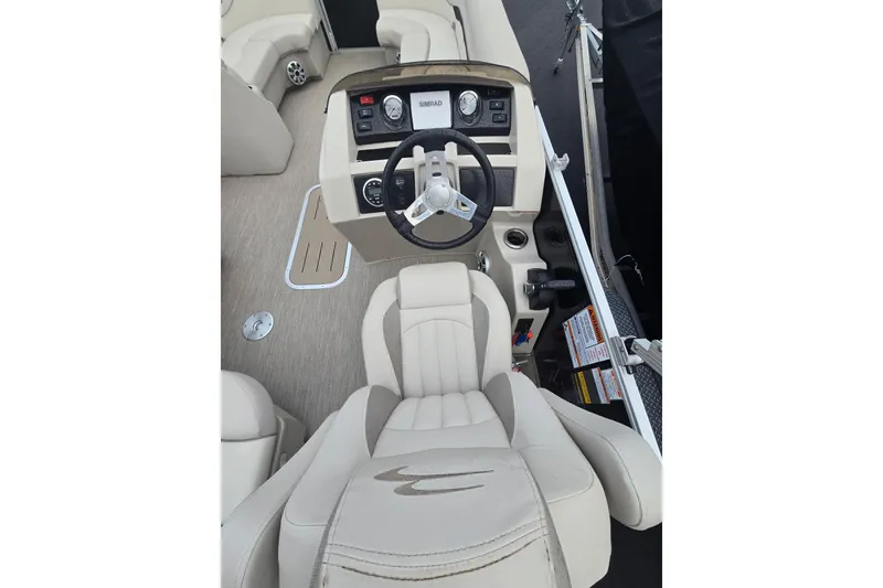 Slide: The Image of Interior view of a 2018 Bennington 22SSX boat with steering console. - 3