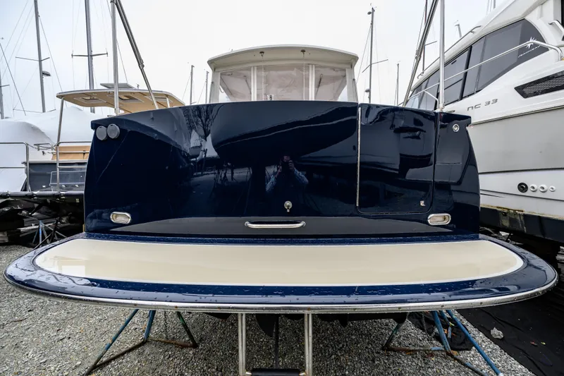 Slide: The Image of 2005 MJM 34z Downeast boat stern view in marina setting. - 12