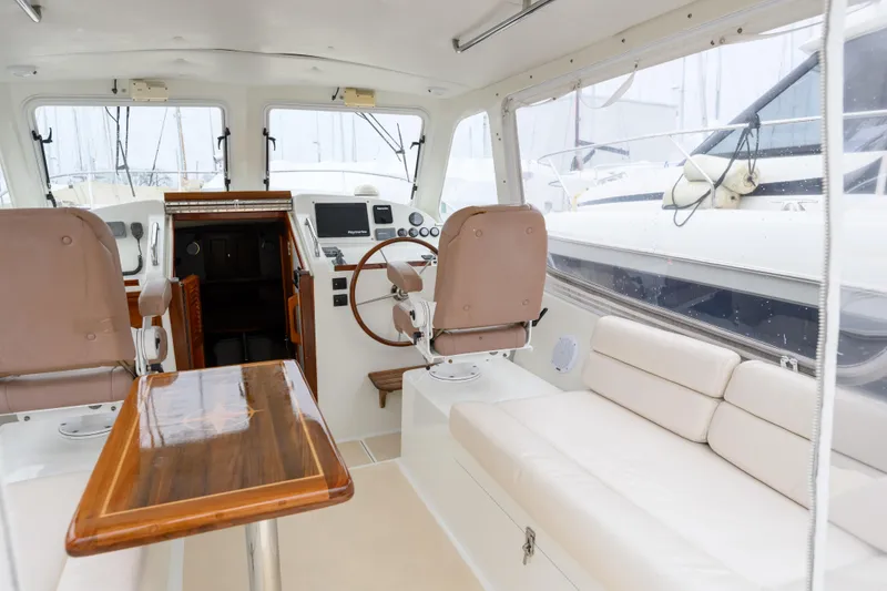 Slide: The Image of Interior of 2005 MJM 34z Downeast boat with seating and helm station. - 24