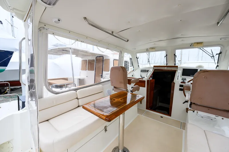 Slide: The Image of Interior of 2005 MJM 34z Downeast boat with seating and navigation area. - 25