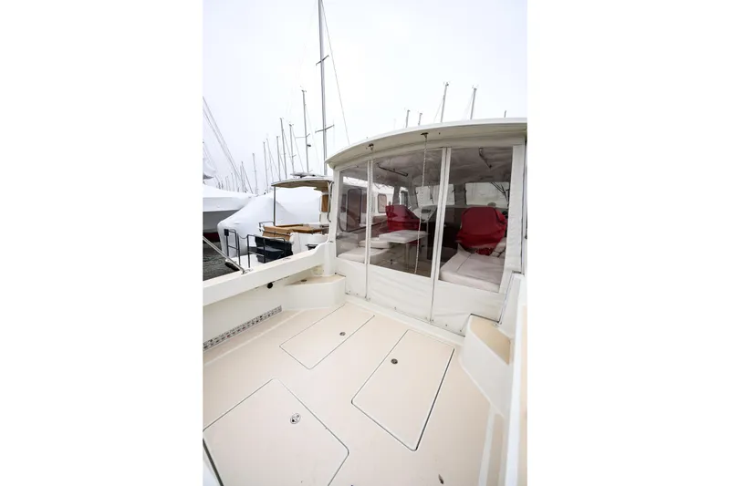 Slide: The Image of 2005 MJM 34z Downeast boat with enclosed cockpit and red seating. - 9