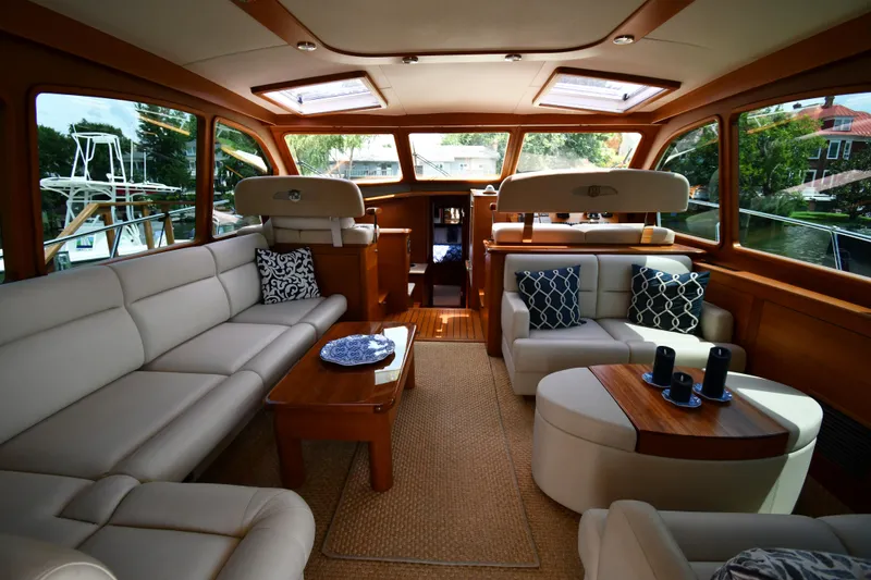 Slide: The Image of Luxurious interior of 2020 Palm Beach Motor Yachts PB52, featuring elegant seating and wooden accents. - 21