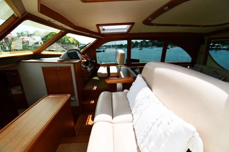 Slide: The Image of Luxurious interior of 2020 Palm Beach Motor Yachts PB52 with elegant seating and scenic views. - 26