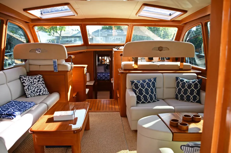 Slide: The Image of Luxurious interior of 2020 Palm Beach Motor Yachts PB52 with elegant seating and wooden accents. - 3