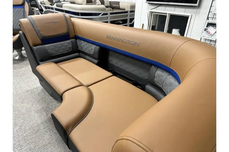 Slide: The Image of 2026 Bennington 22 SSB Swingback boat seating, luxurious brown and black upholstery. - 13