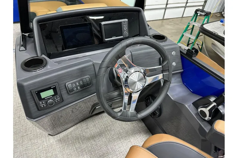 Slide: The Image of 2026 Bennington 22 SSB Swingback boat dashboard with steering wheel and control panel. - 18