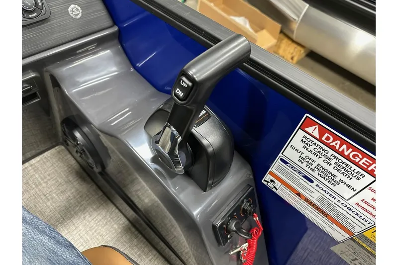 Slide: The Image of Throttle control and safety warning on 2026 Bennington 22 SSB Swingback boat. - 23