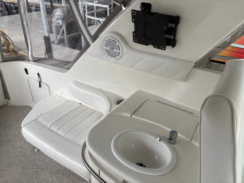 Slide: The Image of Interior of a 1995 Sea Ray Sundancer 370 with seating and sink. - 10