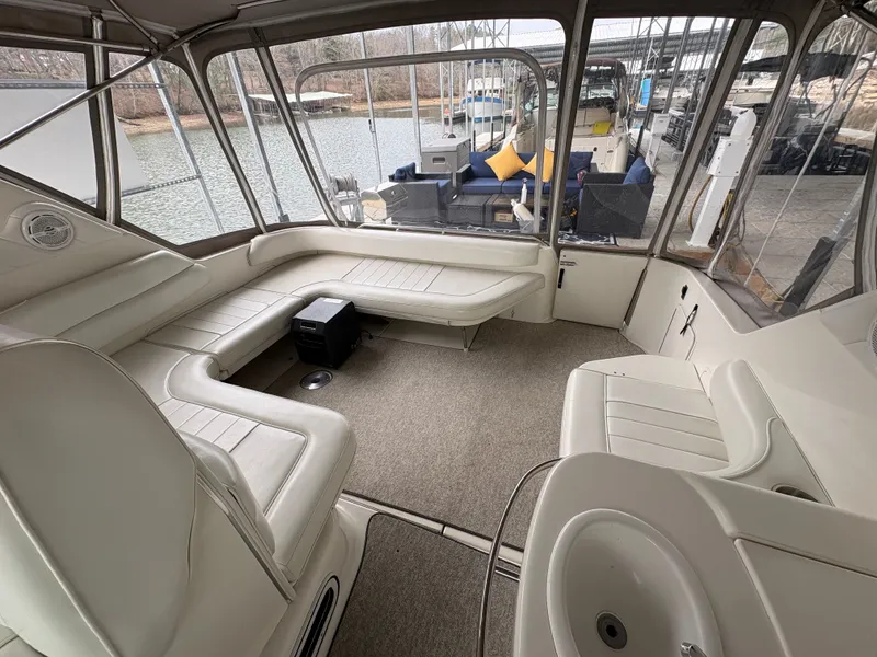 Slide: The Image of Interior of a 1995 Sea Ray Sundancer 370 yacht with seating area. - 12
