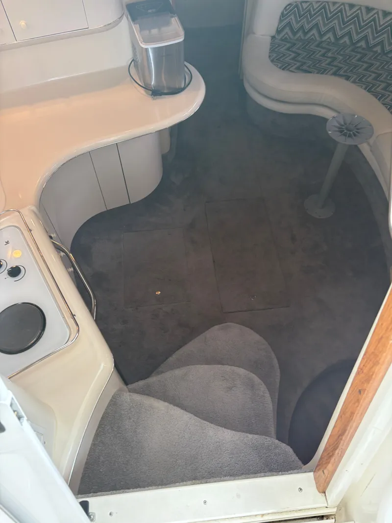 Slide: The Image of Interior of a 1995 Sea Ray Sundancer 370 yacht with carpeted flooring. - 17