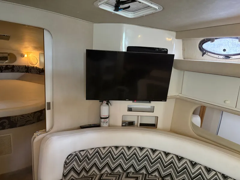 Slide: The Image of 1995 Sea Ray Sundancer 370 yacht interior with TV and seating area. - 20