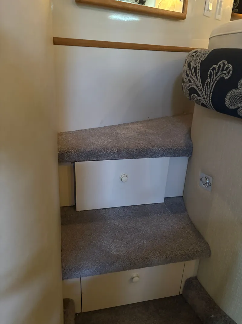 Slide: The Image of Interior of 1995 Sea Ray Sundancer 370, stairs with storage compartments. - 29