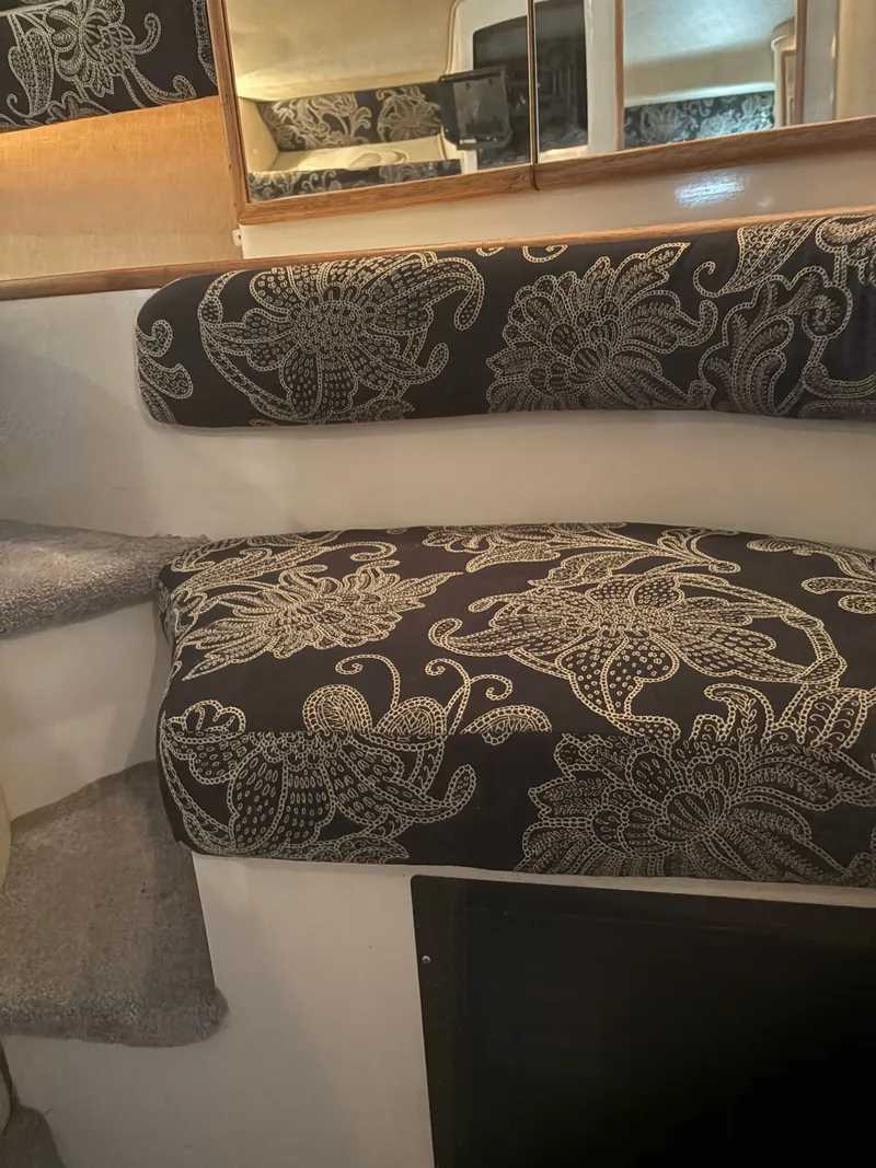 Slide: The Image of 1995 Sea Ray Sundancer 370 interior with patterned upholstery. - 30