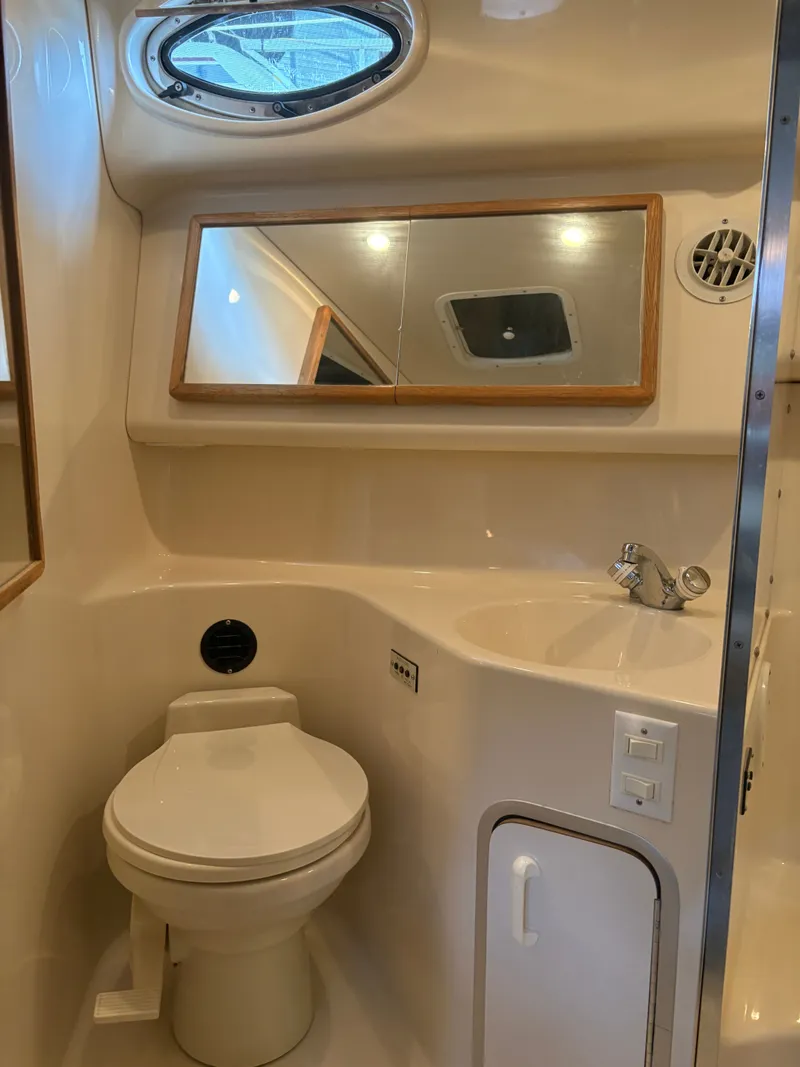 Slide: The Image of Sea Ray Sundancer 370 yacht interior, bathroom with toilet and sink. - 33