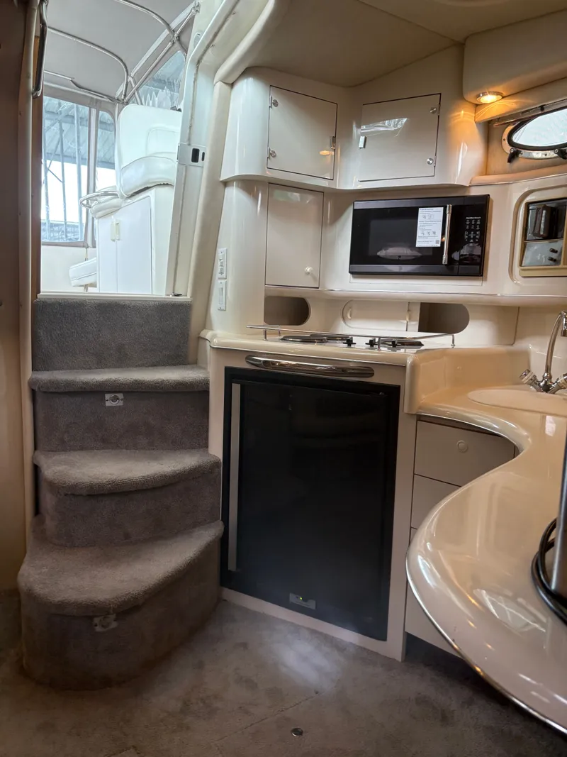 Slide: The Image of 1995 Sea Ray Sundancer 370 yacht interior with kitchen area. - 34