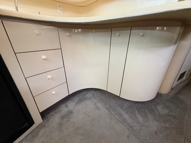Slide: The Image of 1995 Sea Ray Sundancer 370 interior with curved cabinetry. - 42