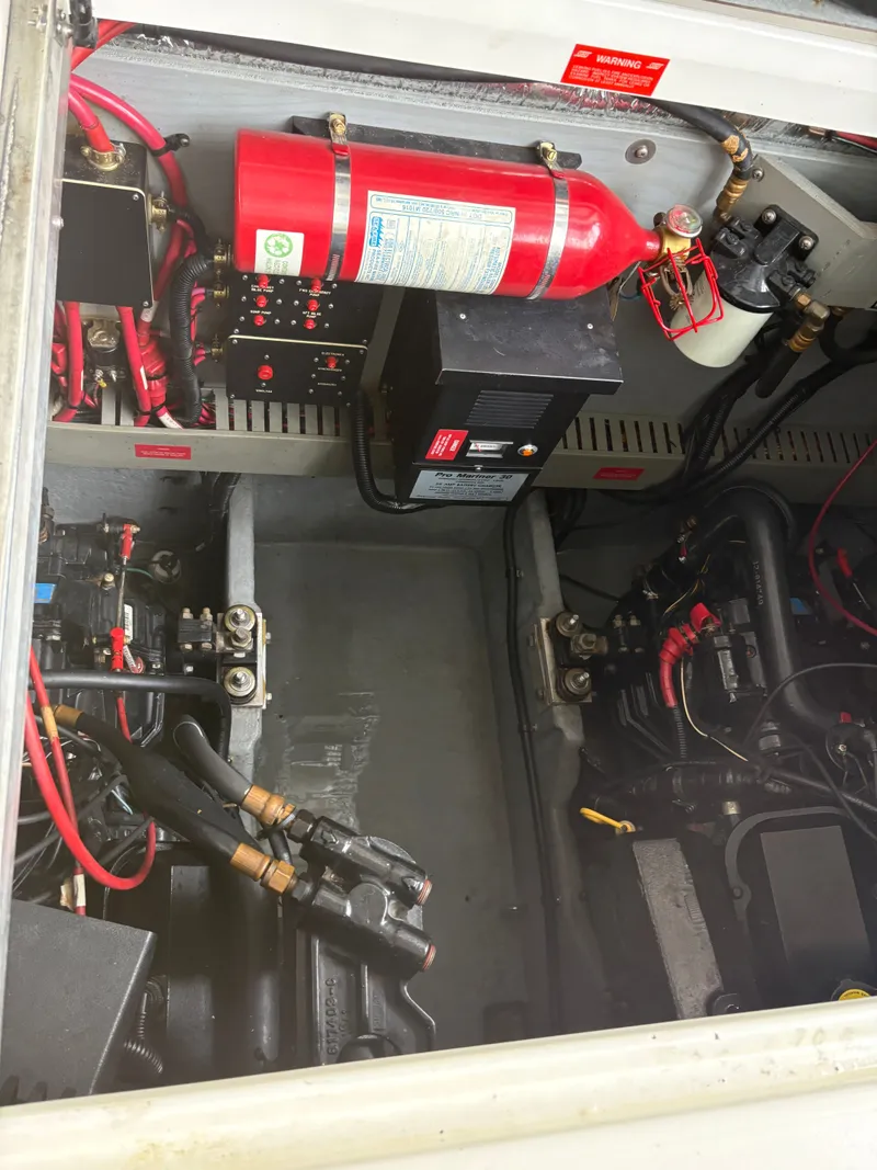 Slide: The Image of Engine compartment of 1995 Sea Ray Sundancer 370 with fire extinguisher. - 47