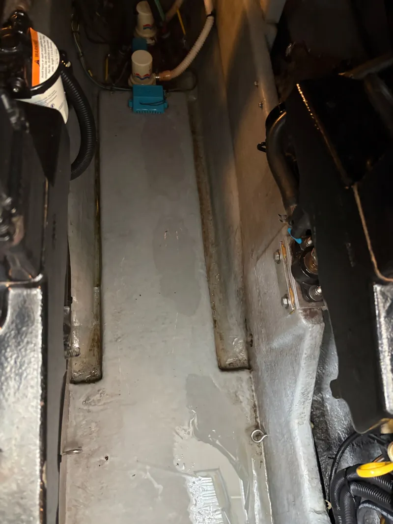 Slide: The Image of Engine compartment of 1995 Sea Ray Sundancer 370 with visible components. - 48