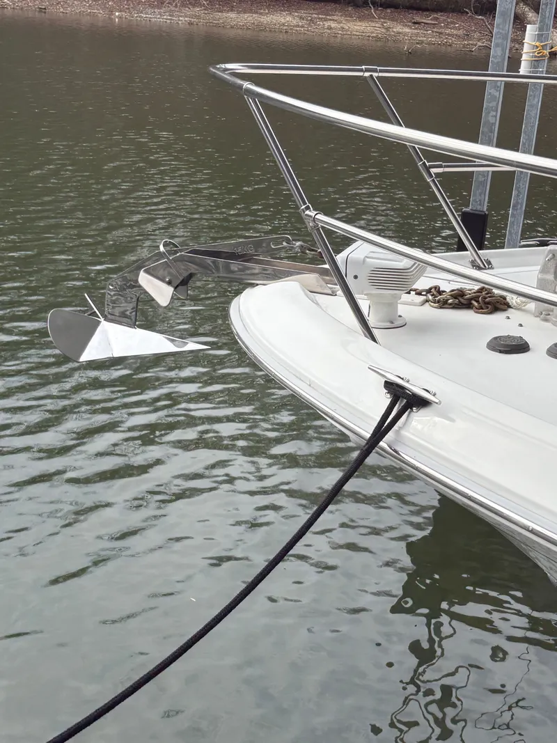Slide: The Image of Bow of a 1995 Sea Ray Sundancer 370 with anchor in water. - 5