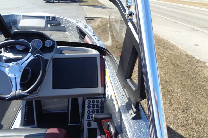 Slide: The Image of 2026 Ranger 1850MS Reata boat dashboard with steering wheel and control panel. - 14