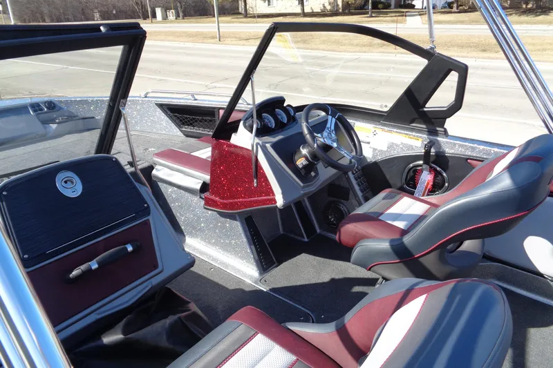 Slide: The Image of 2026 Ranger 1850MS Reata boat interior with modern dashboard and comfortable seating. - 18