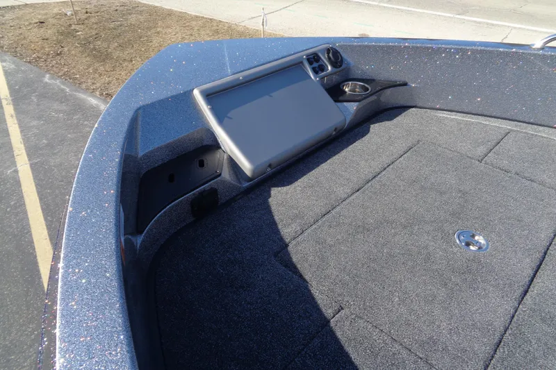 Slide: The Image of 2026 Ranger 1850MS Reata boat deck with control panel and storage compartment. - 19