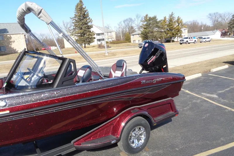 Slide: The Image of 2026 Ranger 1850MS Reata boat with sleek design and powerful engine, parked outdoors. - 3