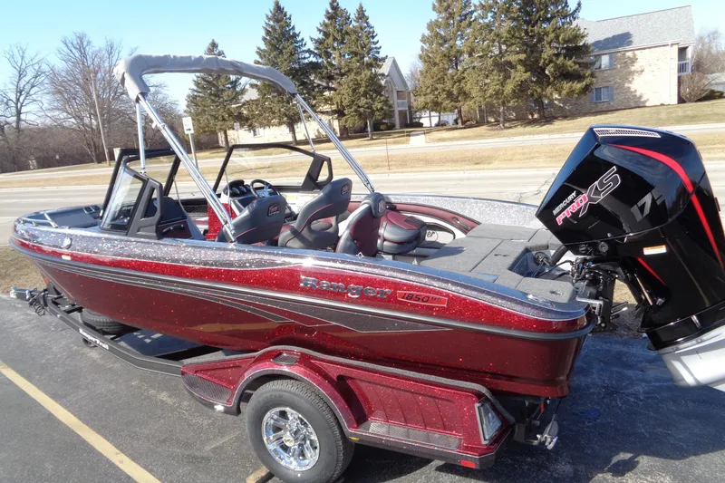 Slide: The Image of 2026 Ranger 1850MS Reata boat with Mercury Pro XS engine, parked outdoors. - 4