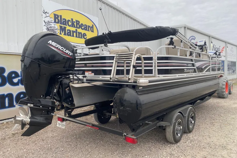 Slide: The Image of 2024 Ranger Reata 220F pontoon boat with Mercury engine at BlackBeard Marine dealership. - 6
