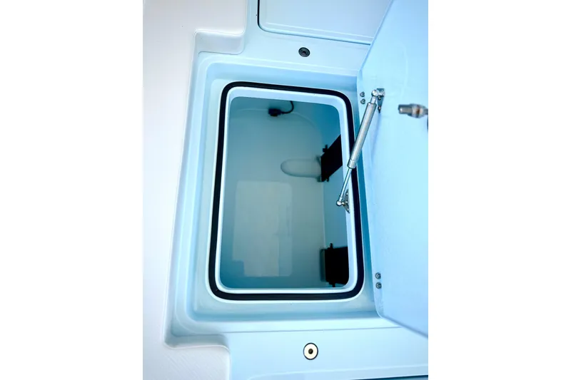 Slide: The Image of Open storage compartment in 2026 Chittum Skiffs 18 Islamorada boat. - 11