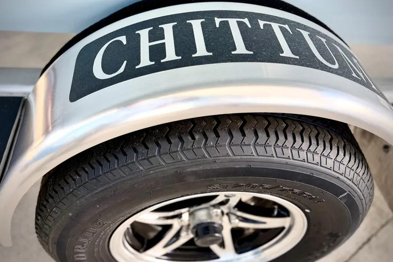 Slide: The Image of Close-up of Chittum Skiffs 18 Islamorada 2026 trailer tire and fender. - 13