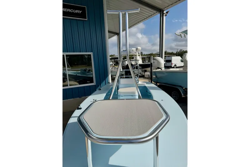 Slide: The Image of 2026 Chittum Skiffs 18 Islamorada boat, featuring a sleek deck and sturdy railing. - 17