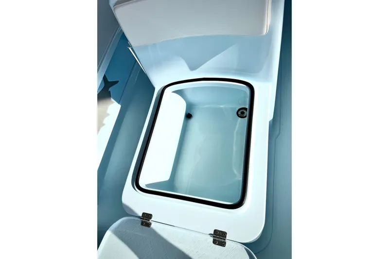 Slide: The Image of Livewell compartment in 2026 Chittum Skiffs 18 Islamorada boat, featuring sleek design. - 18