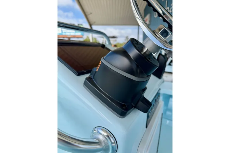 Slide: The Image of 2026 Chittum Skiffs 18 Islamorada steering wheel and console detail. - 21
